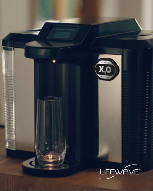 LifeWave X2O light-infused water machine dispensing water into a glass
